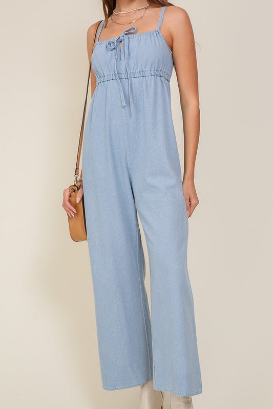 DENIM BLUE SLEEVELESS JUMPSUIT WITH SELF FRONT TIE Jumpsuits and Rompers