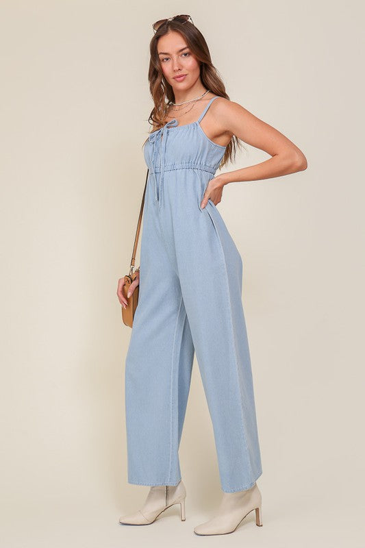 DENIM BLUE SLEEVELESS JUMPSUIT WITH SELF FRONT TIE Jumpsuits and Rompers