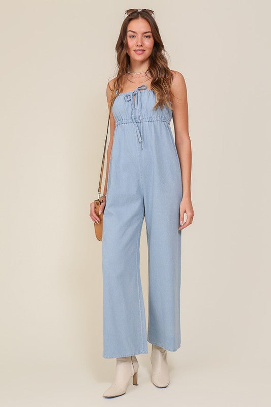 DENIM BLUE SLEEVELESS JUMPSUIT WITH SELF FRONT TIE Denim Blue Jumpsuits and Rompers